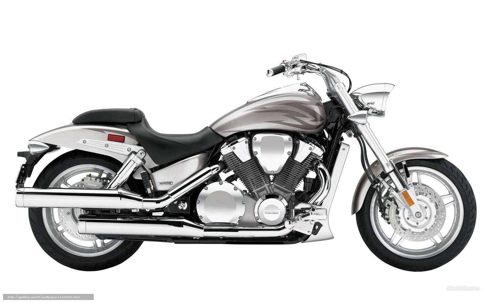silver Honda cruiser motorcycle