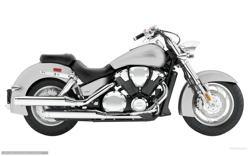 silver Honda cruiser motorcycle