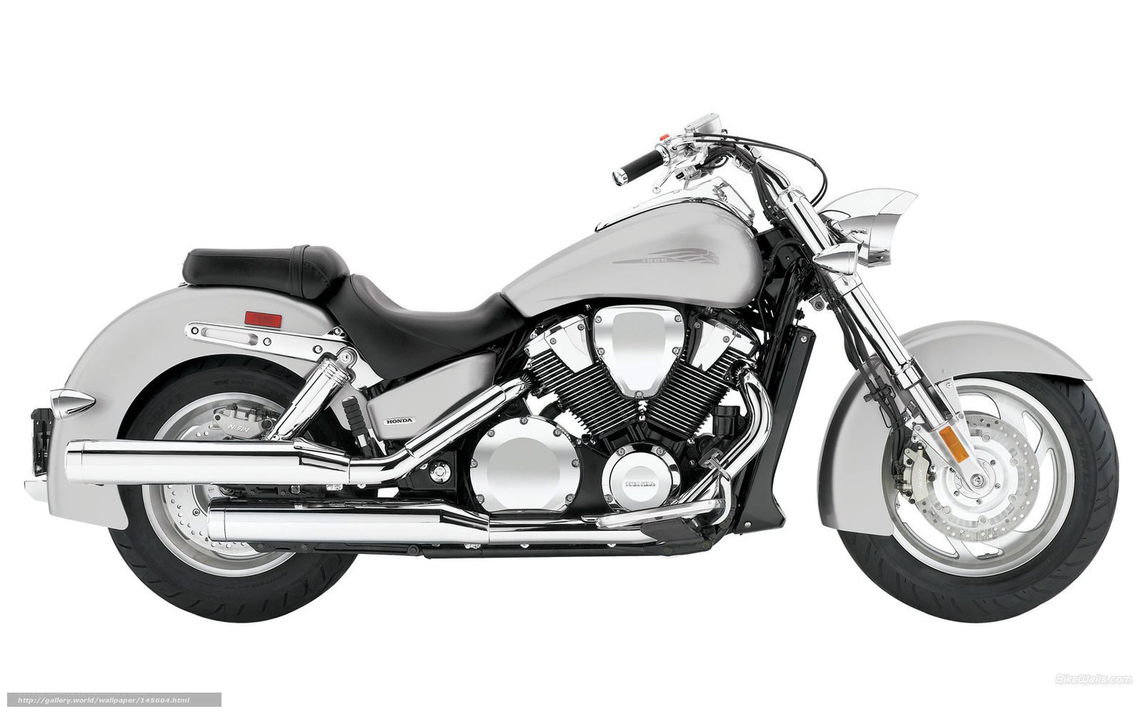 silver Honda cruiser motorcycle