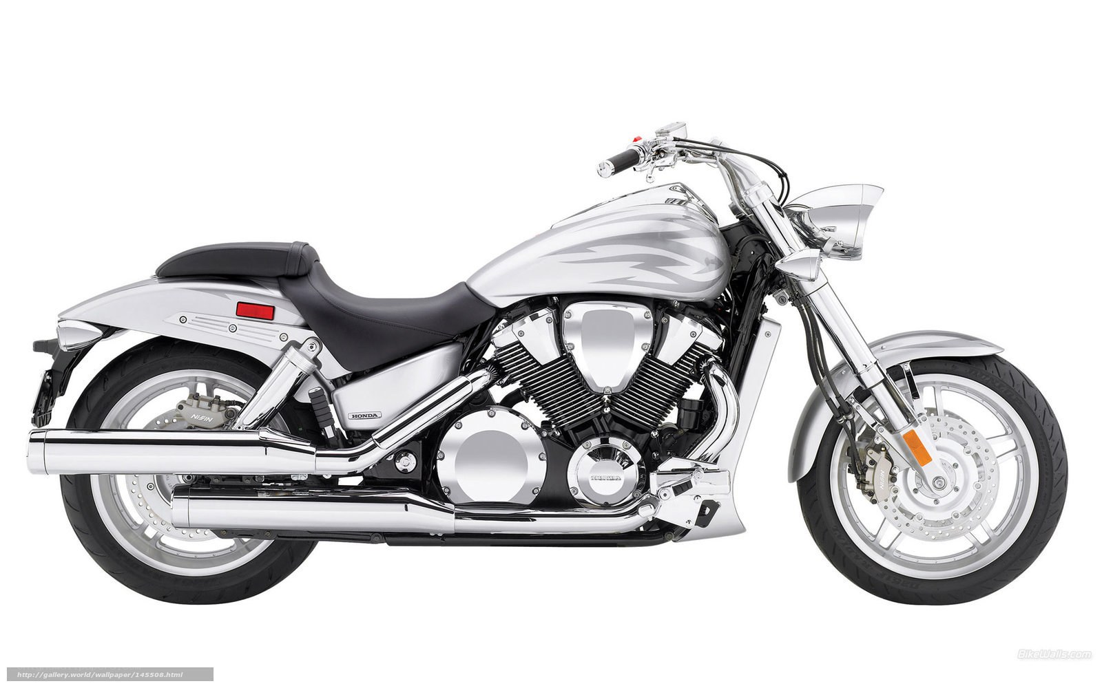 silver Honda cruiser motorcycle