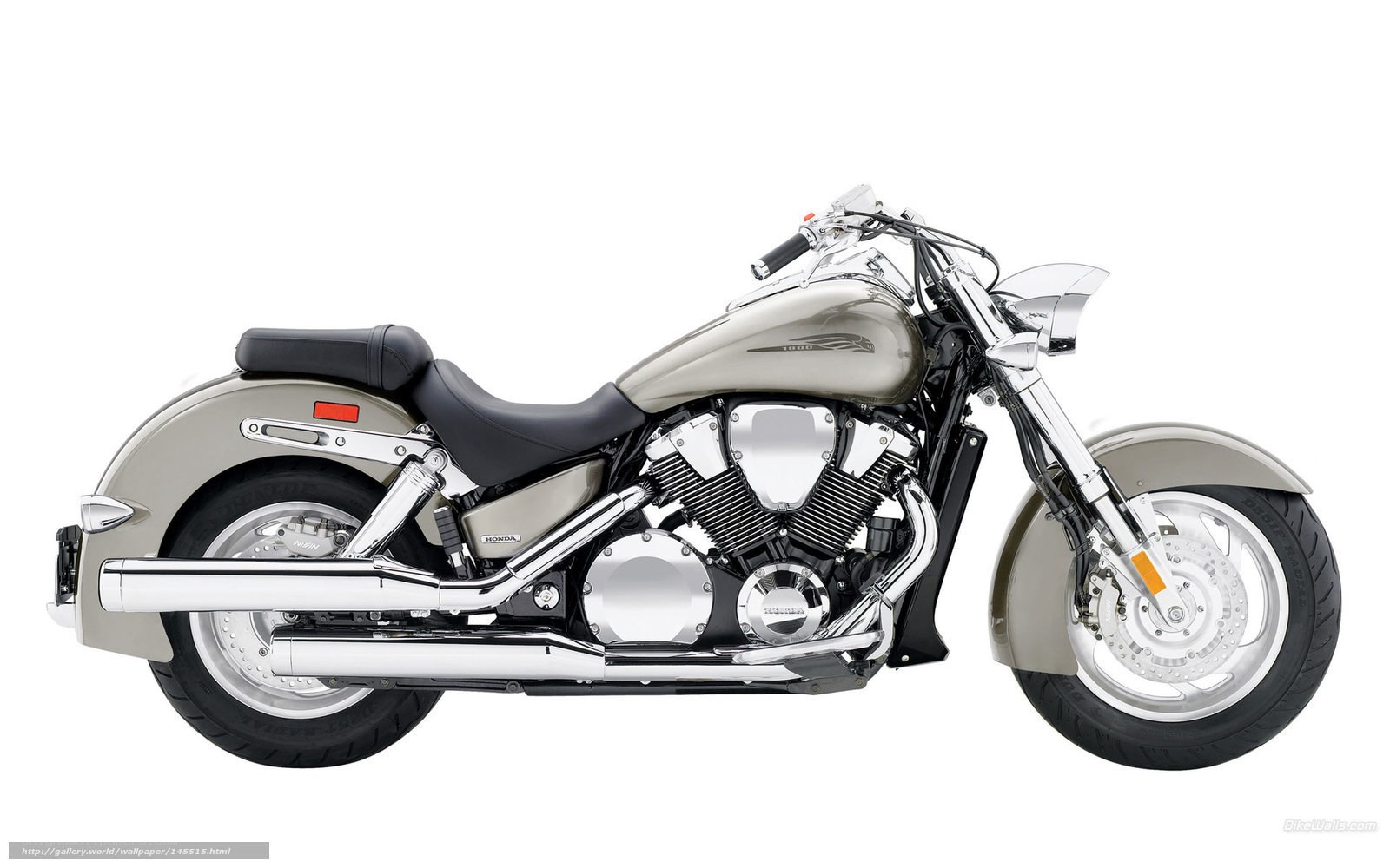 silver Honda cruiser motorcycle