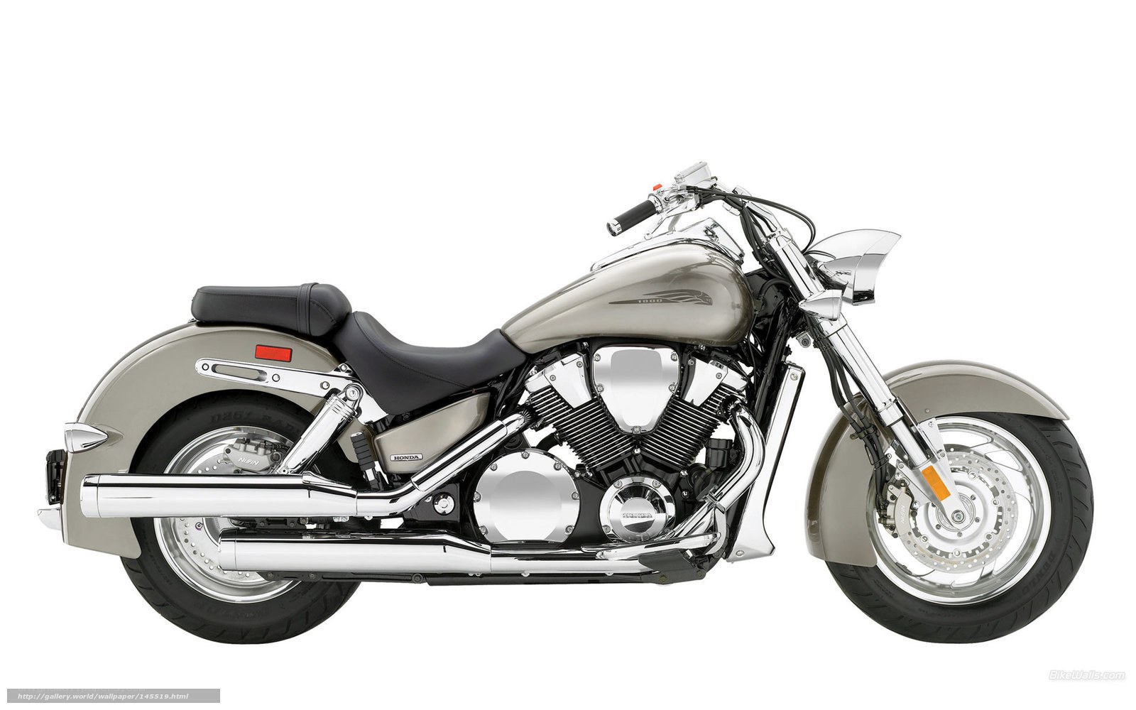 silver Honda cruiser motorcycle