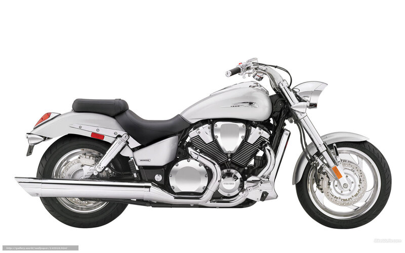 silver Honda cruiser motorcycle
