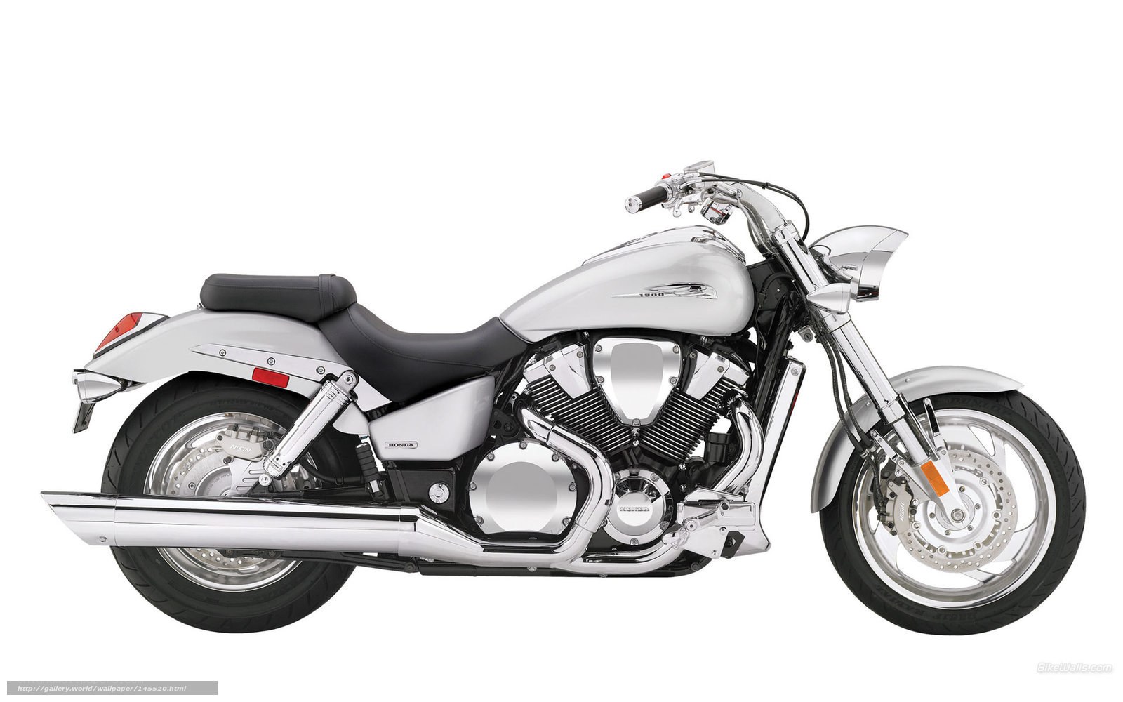 silver Honda cruiser motorcycle