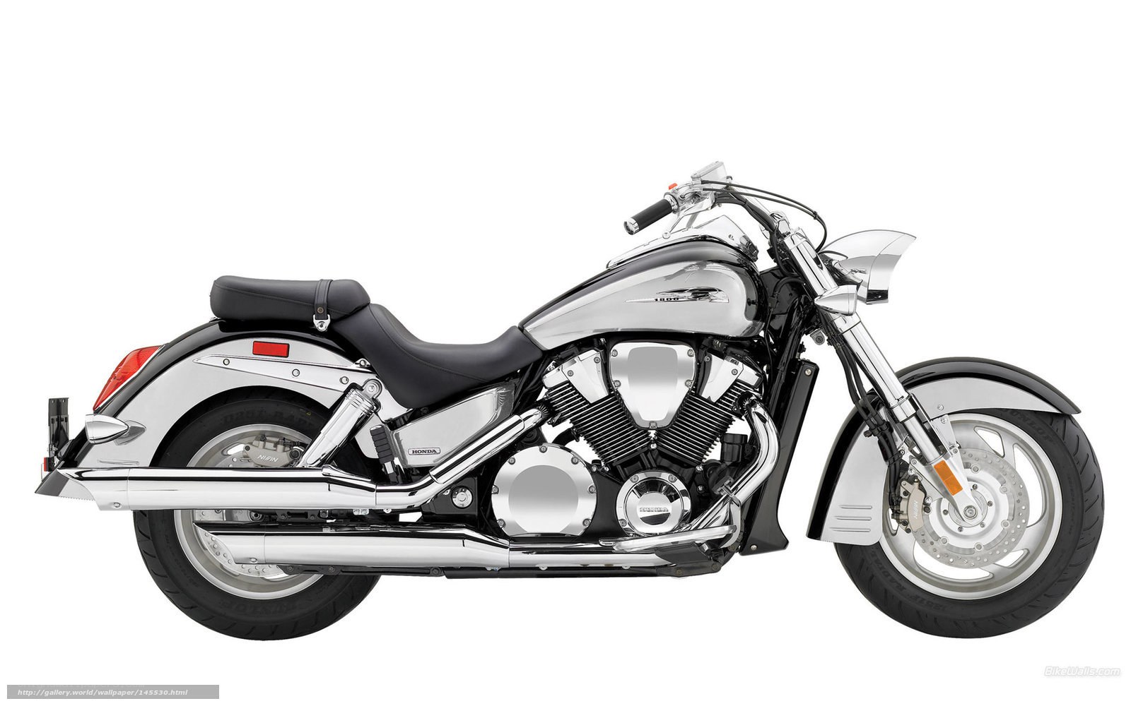 silver honda cruiser motorcycle