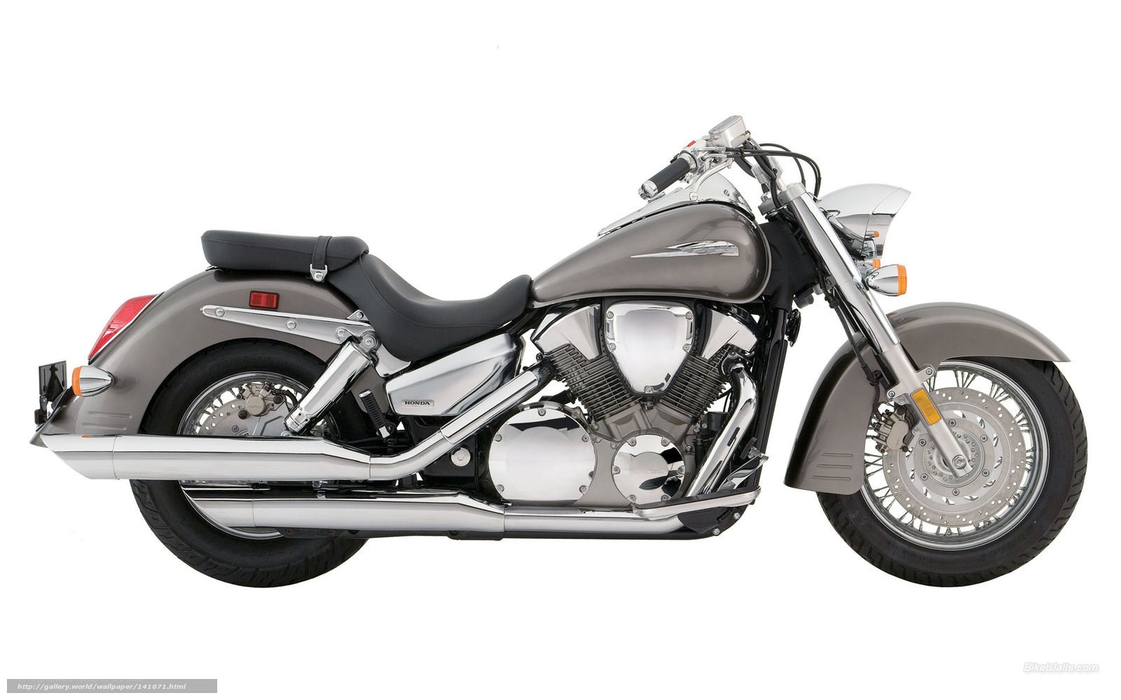 silver Honda cruiser motorcycle