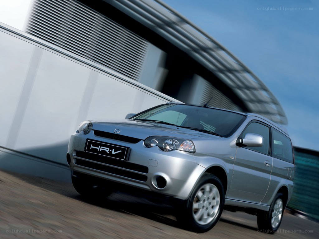Silver Honda HR-V driving