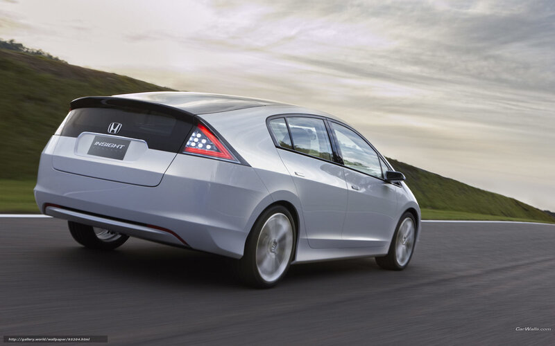 Silver Honda Insight in motion