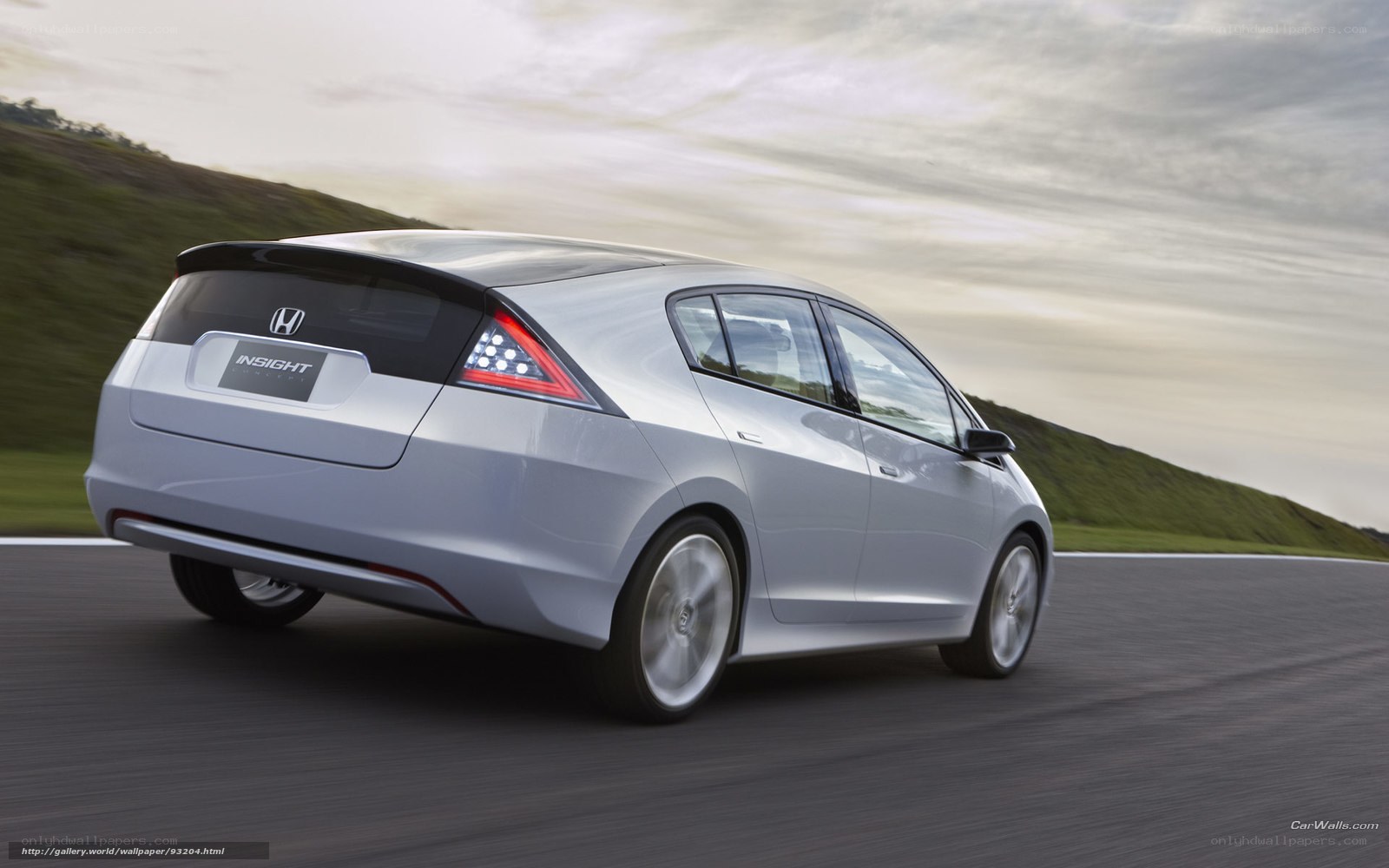 Silver Honda Insight in motion