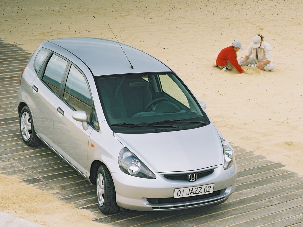Silver Honda Jazz on a boardwalk