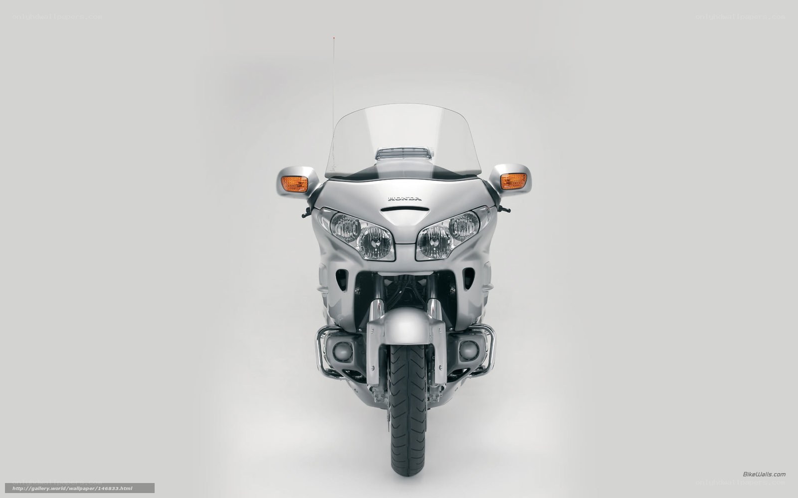 silver honda motorcycle front view
