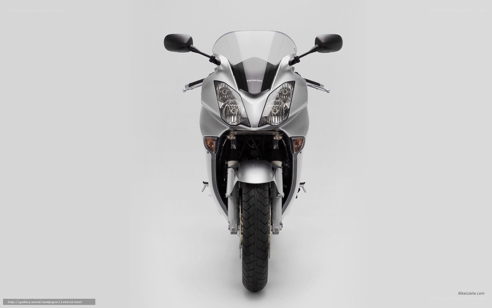silver honda motorcycle front view