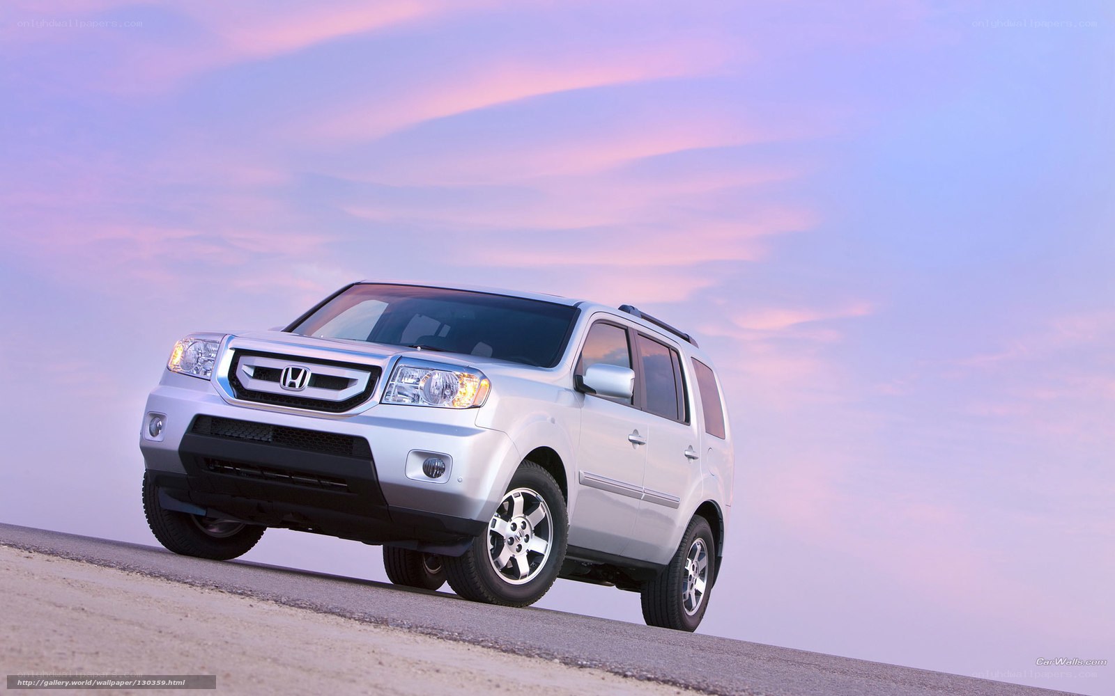 Silver Honda Pilot at sunset