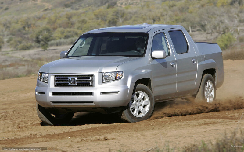 Silver Honda Ridgeline on dirt road
