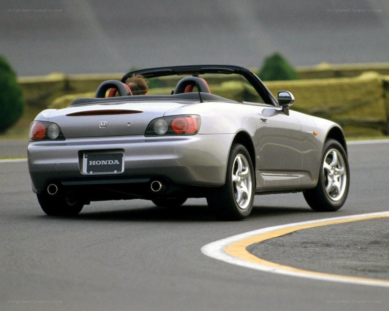 Silver Honda S2000 on a racetrack
