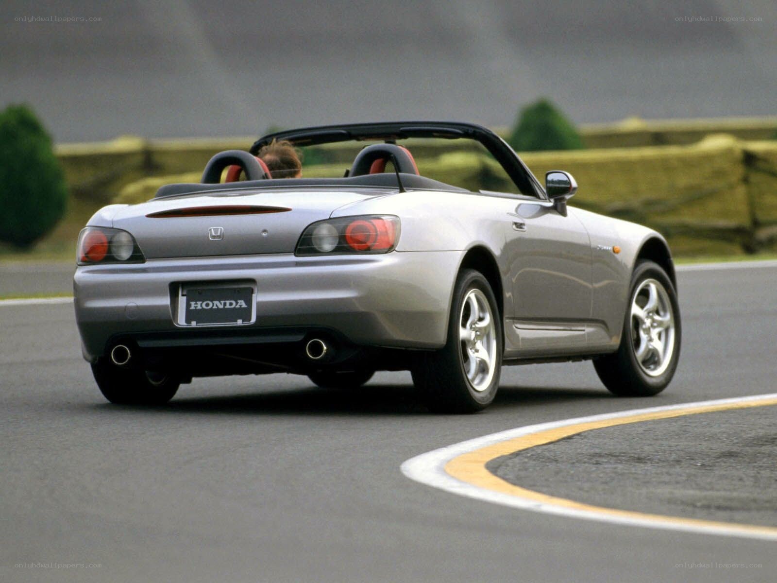 Silver Honda S2000 on a racetrack