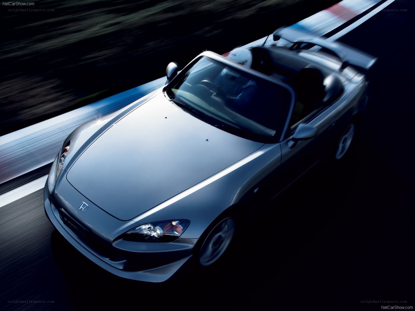 Silver Honda S2000 on a racetrack