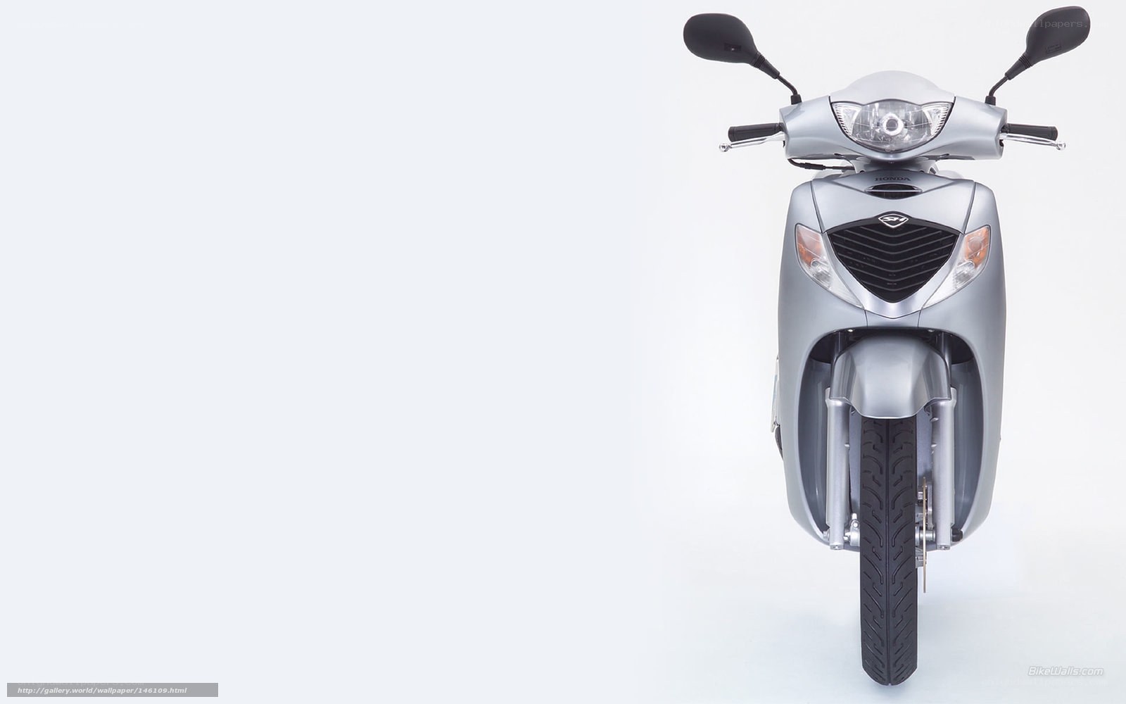 Silver Honda scooter front view