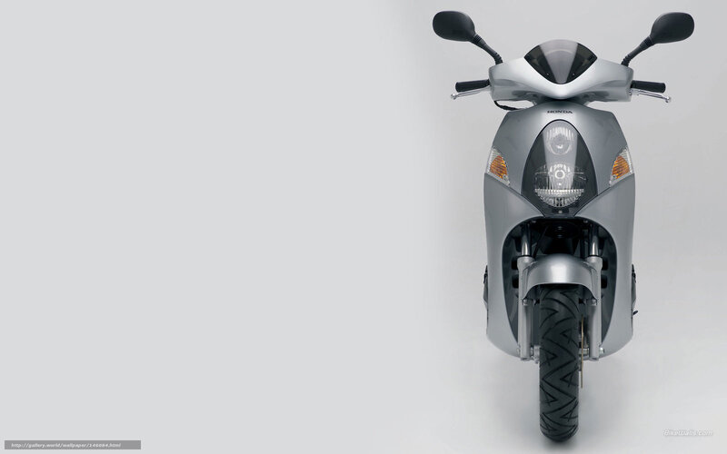 Silver Honda scooter front view