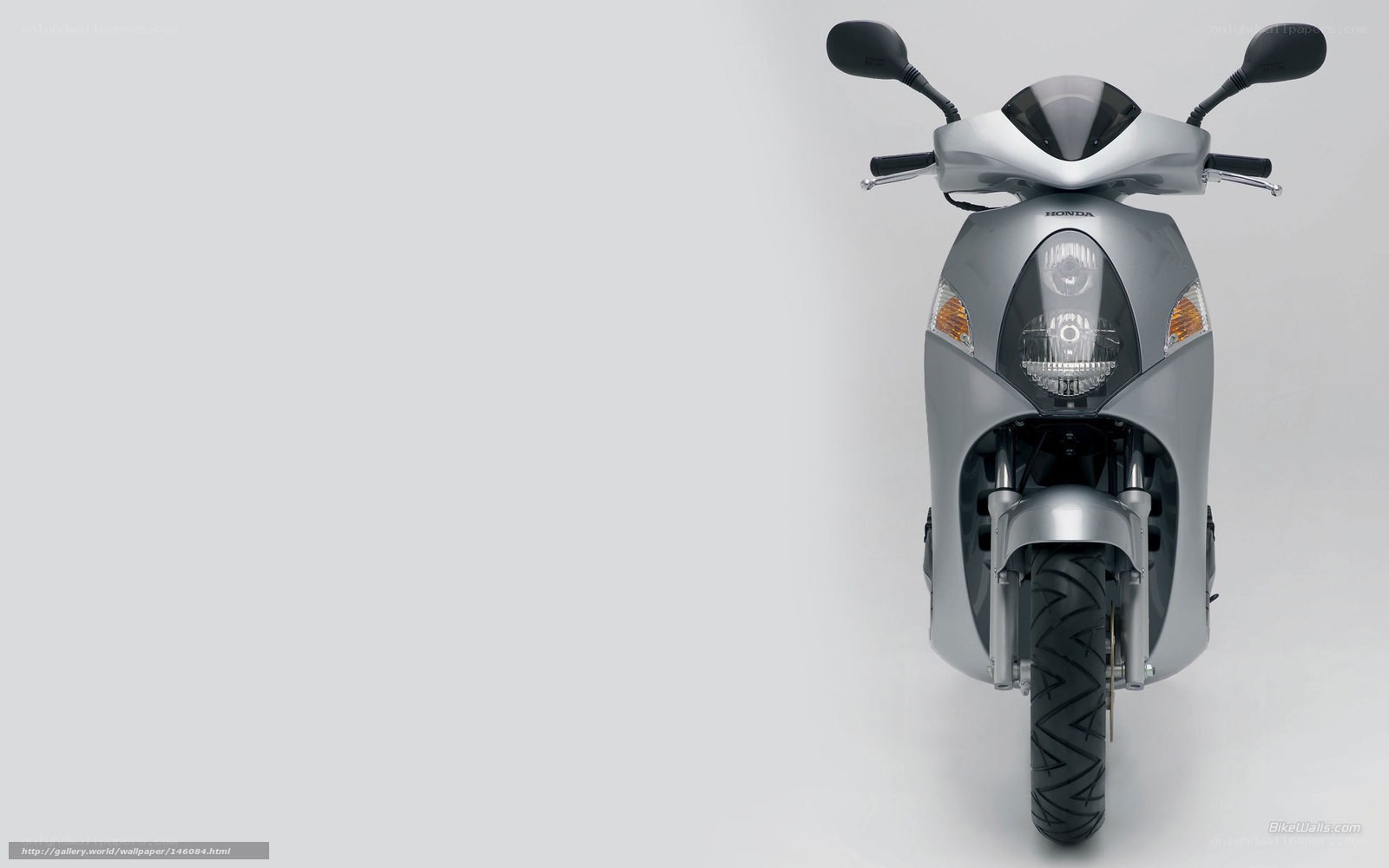 Silver Honda scooter front view