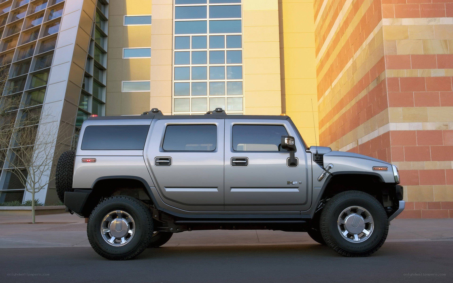 Silver Hummer H2 parked outside