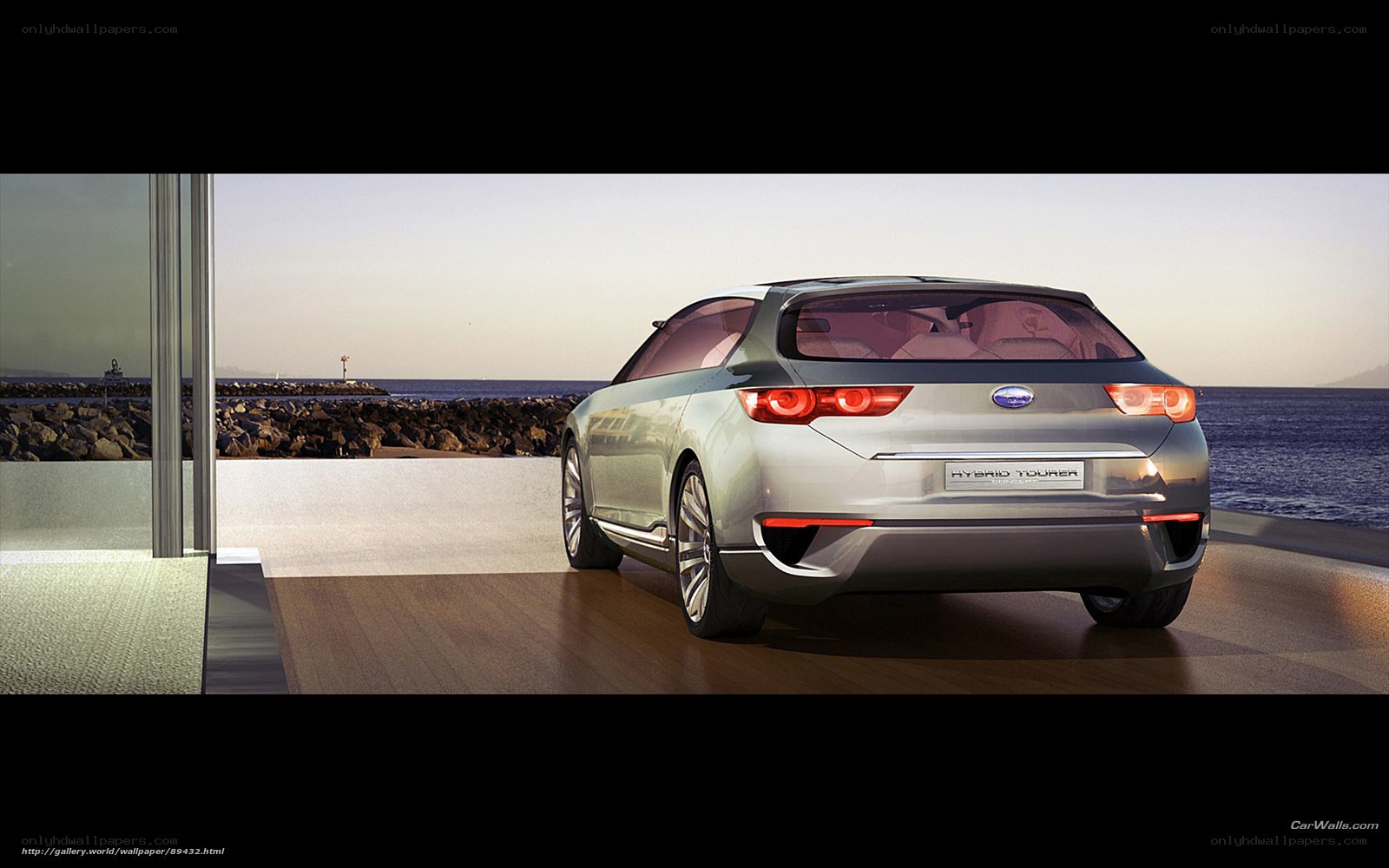 Silver hybrid car by the sea