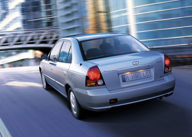 silver hyundai accent in motion