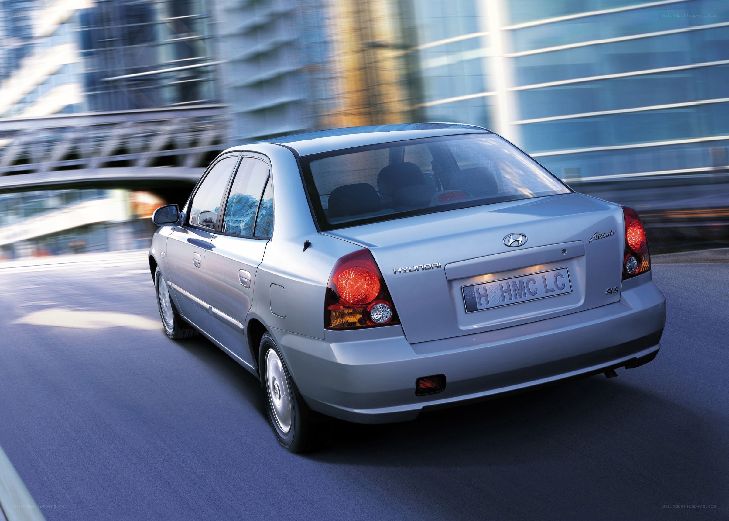 silver hyundai accent in motion