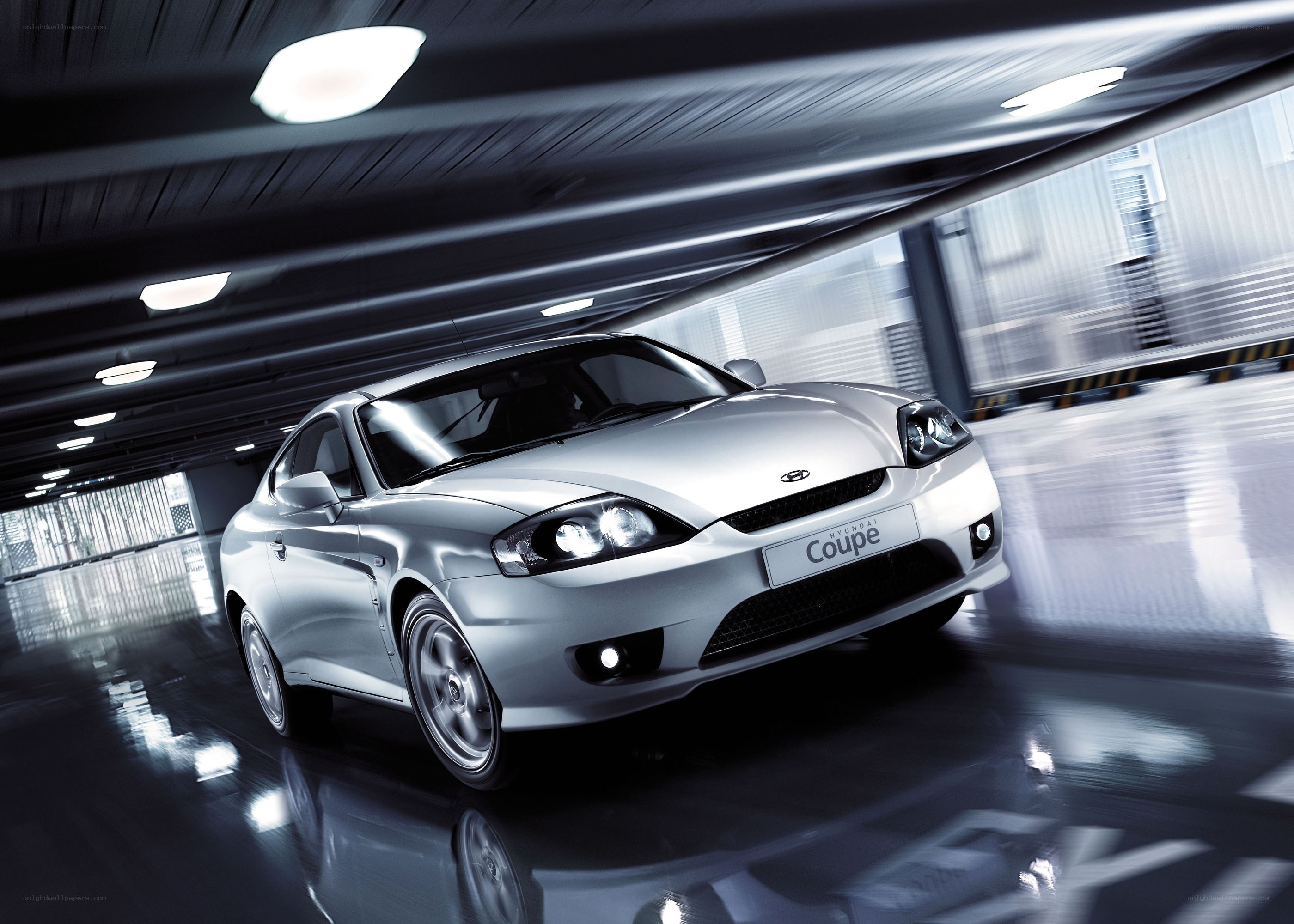 Silver Hyundai Coupe in motion