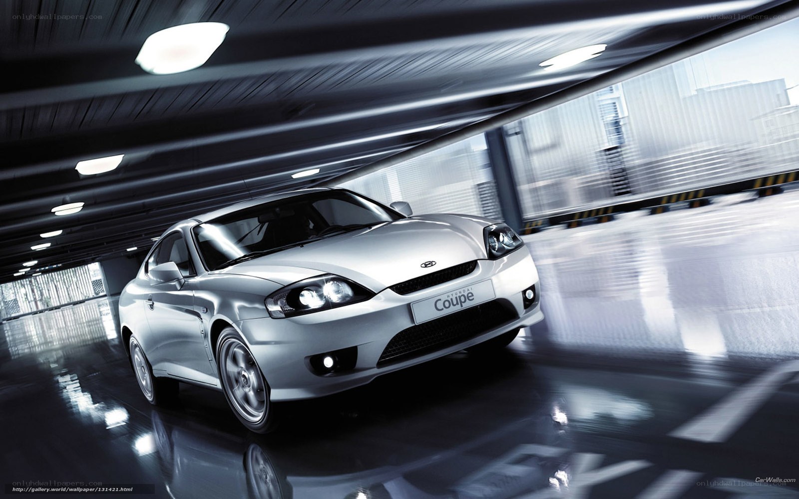 Silver Hyundai Coupe in motion