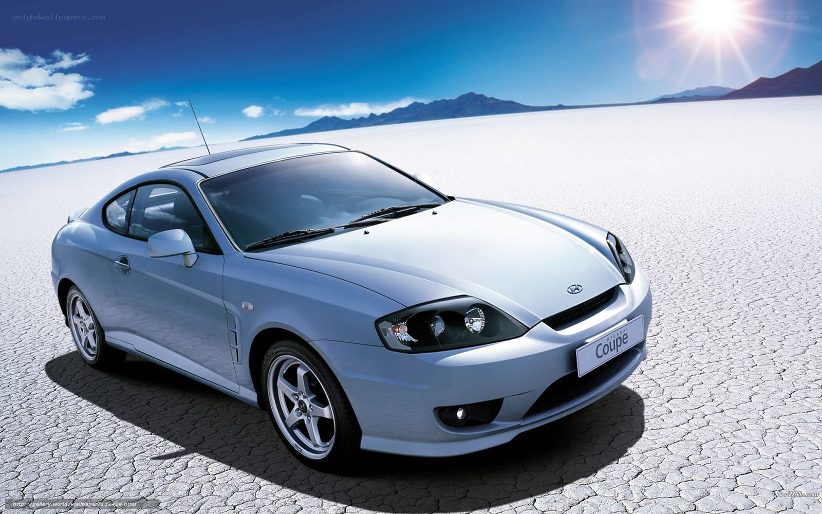 Silver Hyundai Coupe on salt flat