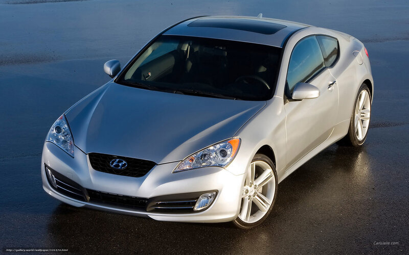 silver hyundai coupe on wet pavement