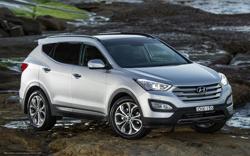 Silver Hyundai Santa Fe on rocky shore