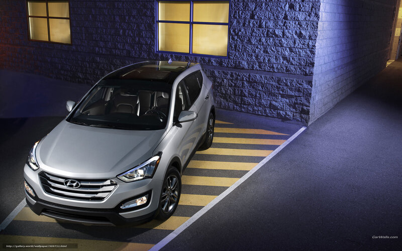 Silver Hyundai Santa Fe parked at night
