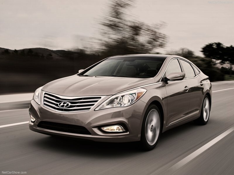 silver hyundai sedan in motion