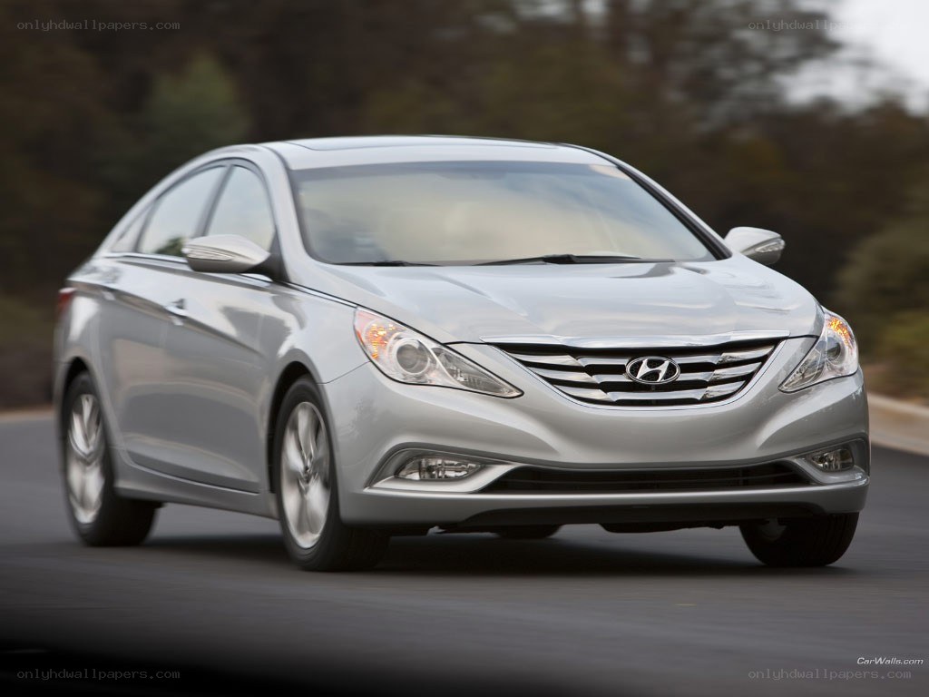 silver hyundai sonata in motion