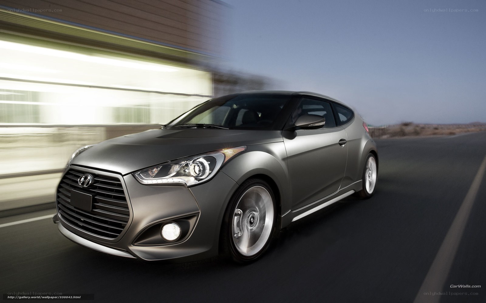 silver hyundai veloster in motion