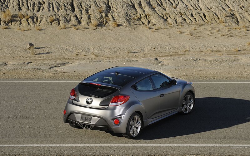 silver hyundai veloster on desert road