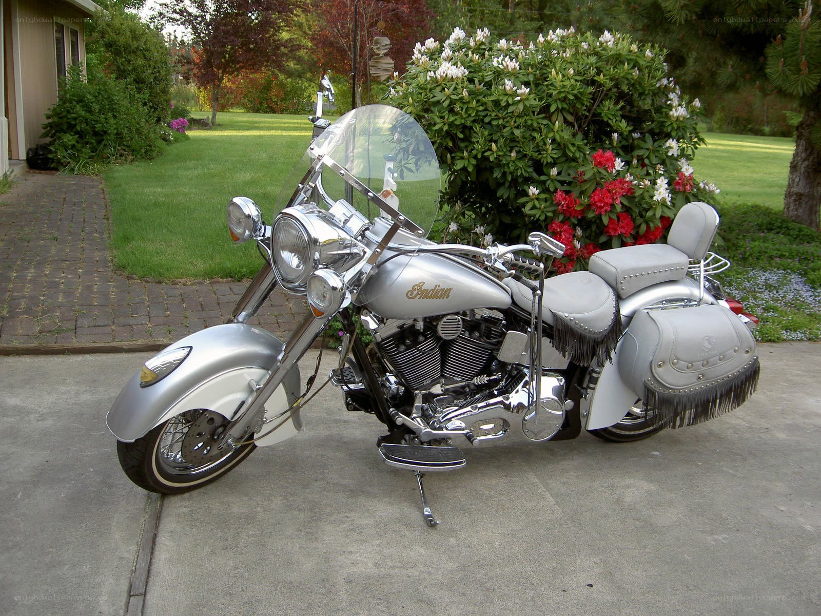 Silver Indian motorcycle in driveway
