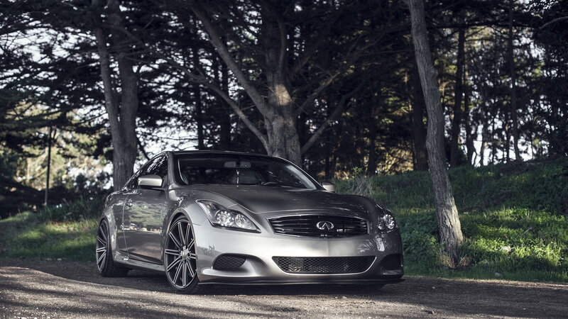 silver infini car in forest