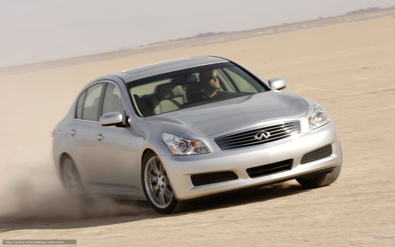 silver infini driving on sand