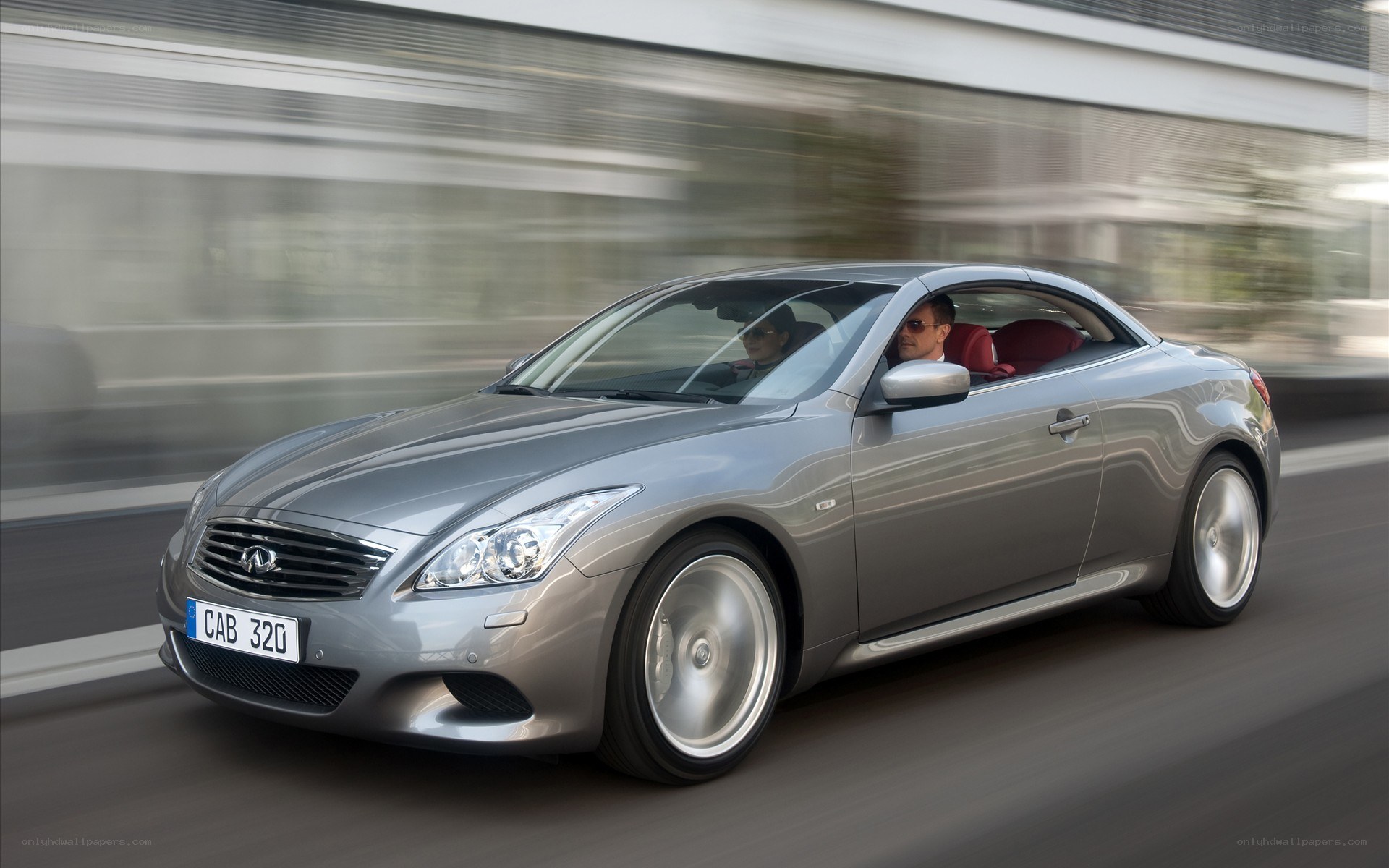 silver infiniti convertible in motion