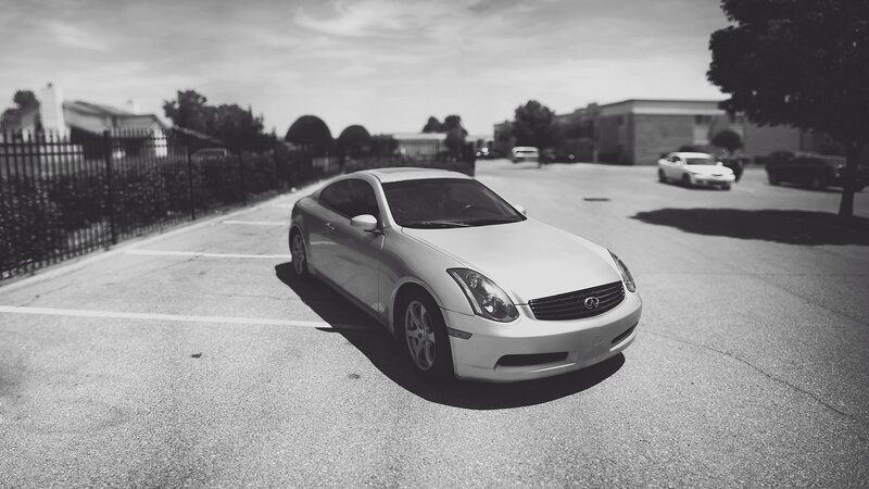 silver infiniti coupe in parking lot