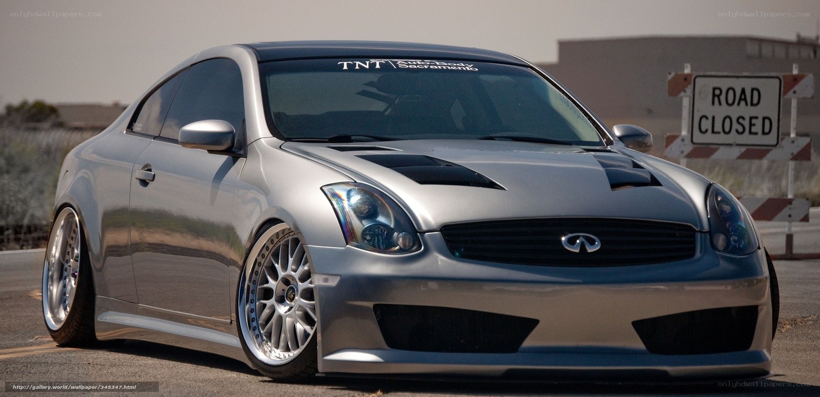 silver infiniti coupe on road