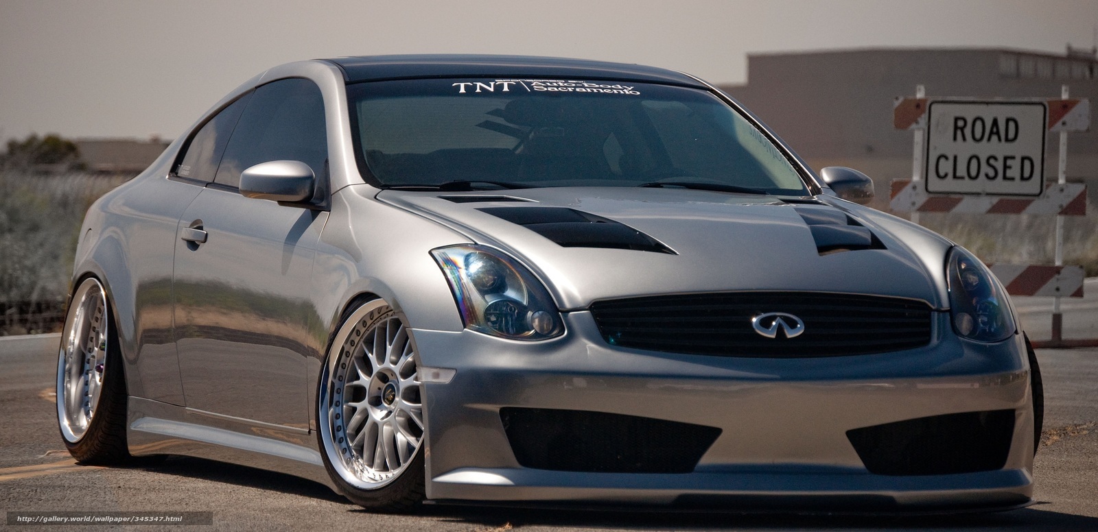 silver infiniti coupe on road