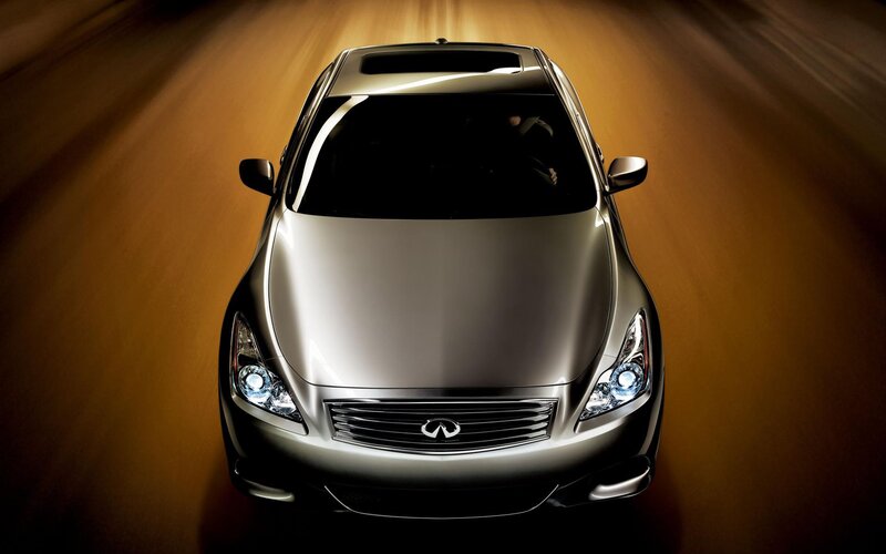 silver infiniti driving at night