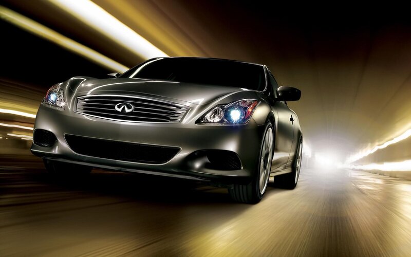 silver infiniti driving in tunnel