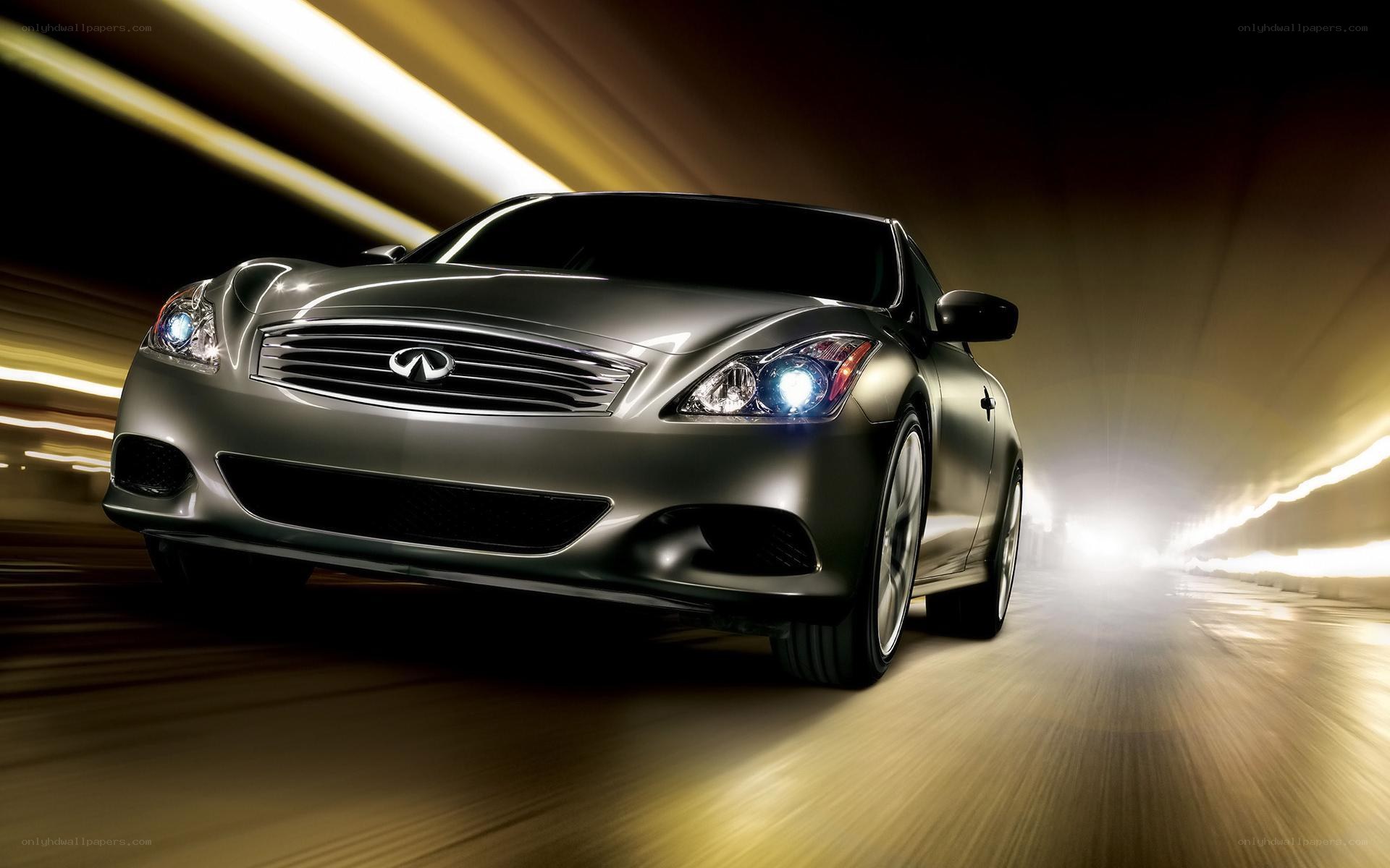 silver infiniti driving in tunnel