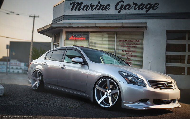Silver Infiniti G37 at a garage