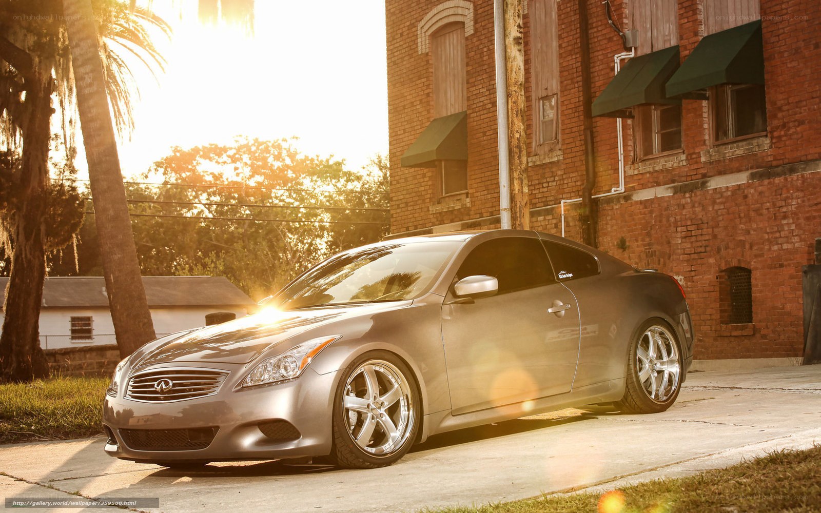 Silver Infiniti G37 at sunset